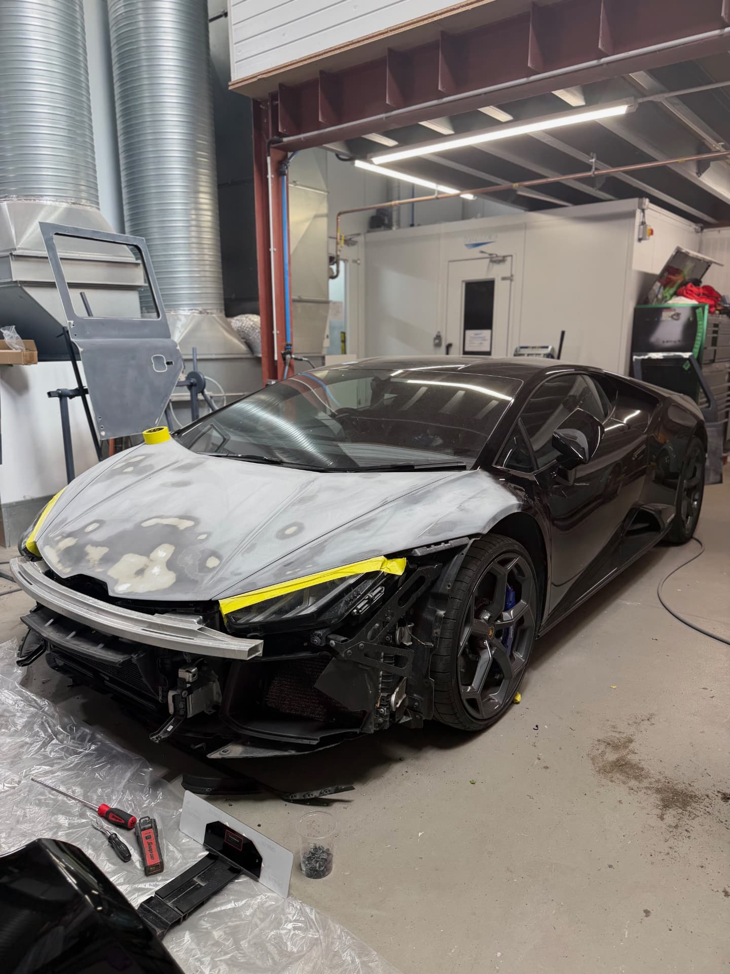 Lamborghini Huracán front end masked and prepared for paint